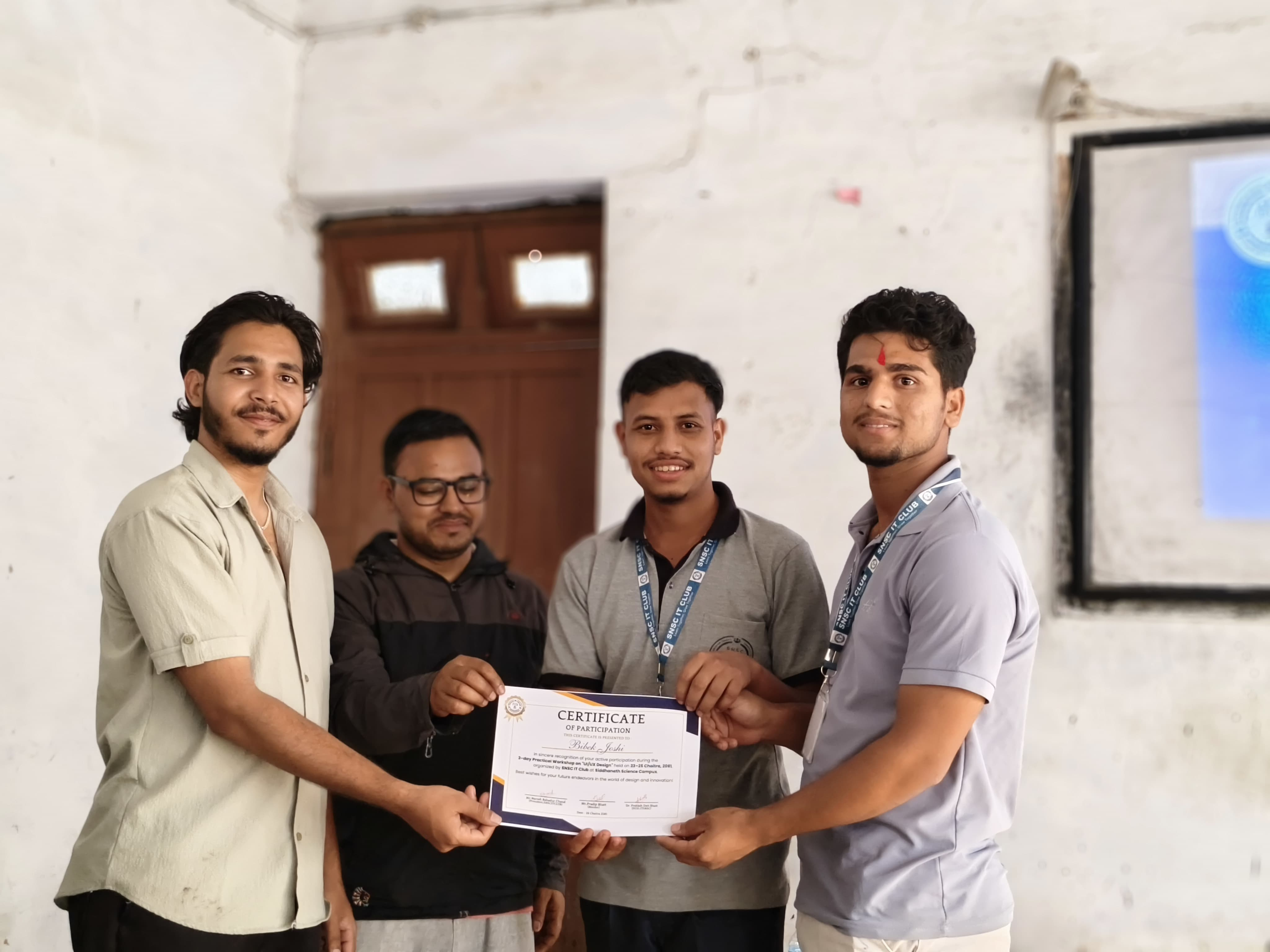 Bibek Joshi receiving a certificate